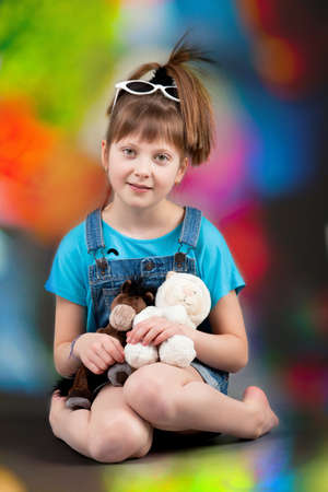 young happy girl.  little girl on a gray backgroundのeditorial素材