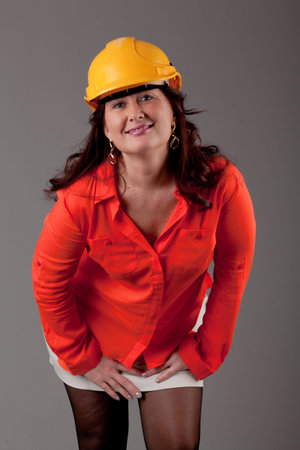 young woman over grey background.  Portrait of a beautiful  woman, over a gray background