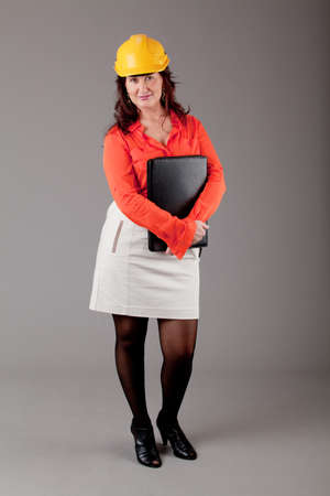 young woman over grey background.  Portrait of a beautiful  woman, over a gray backgroundの写真素材