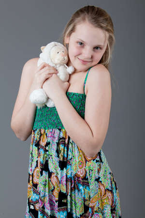 young happy girl.  little girl on a gray backgroundの写真素材