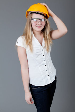 young happy girl.  little girl on a gray backgroundの写真素材