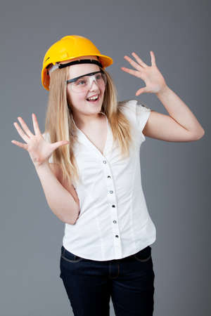 young happy girl.  little girl on a gray backgroundの写真素材