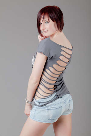 attractive smiling woman  Portrait of an attractive young woman   lady posing on grey background の写真素材