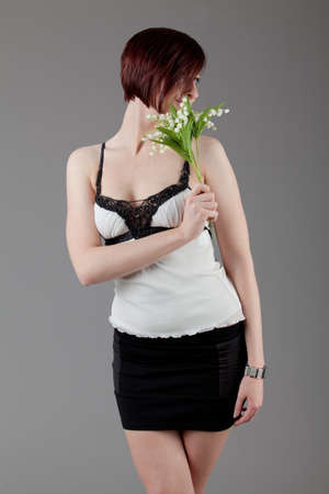 attractive smiling woman  Portrait of an attractive young woman   lady posing on grey background の写真素材