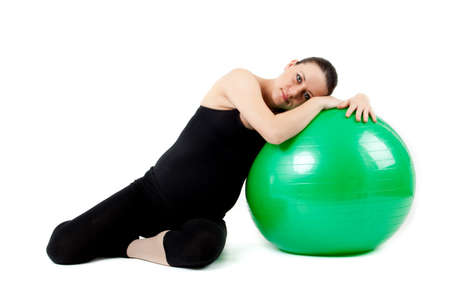 Pregnant woman excercises with gymnastic ball.の写真素材