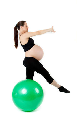 Pregnant woman excercises with gymnastic ball.の写真素材