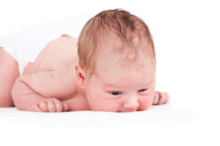 one week old baby boy on white の写真素材