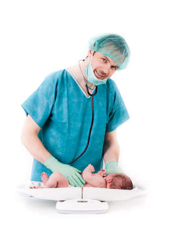 doctor and baby on a white background  Little baby on scales の写真素材