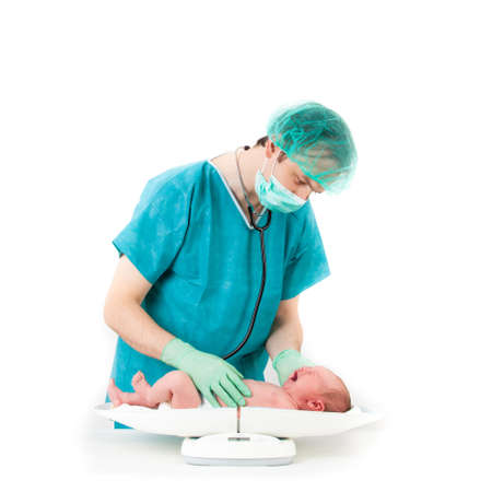 doctor and baby on a white background  Little baby on scales の写真素材