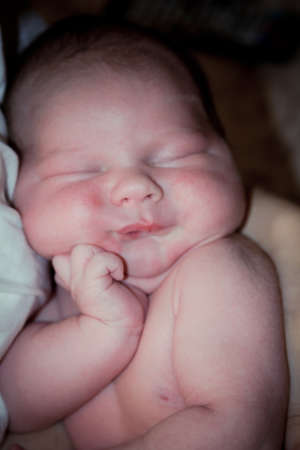 Beautiful one week old baby boy asleep の写真素材