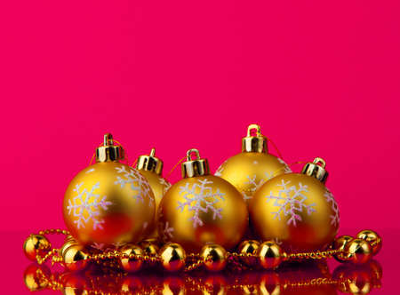 golden christmas balls of red backgroundの写真素材