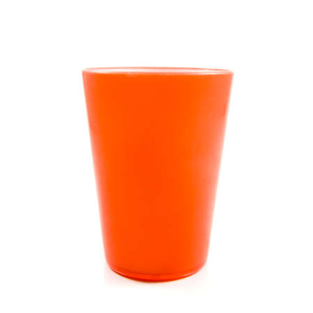 Orange plastic cup isolated on whiteの写真素材