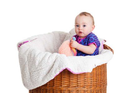 Baby Girl Sitting in the  Basket.の写真素材