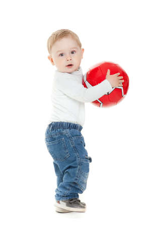 Little boy playing with a ball.  beautiful little kid  play with ball on white background,isolatedの写真素材