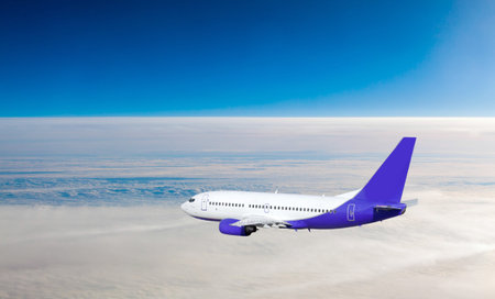 Airplane at fly on the sky with clouds