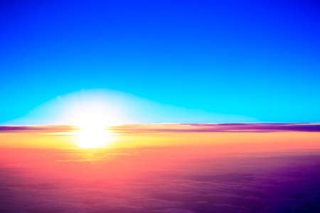 sunset with a height of 10 000 km. Dramatic sunset. View of sunset above clouds from airplane windowの写真素材