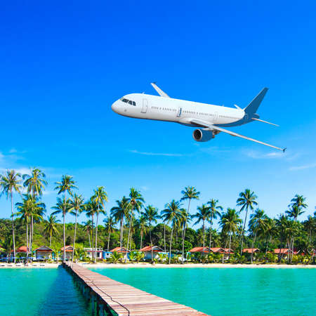Jet plane over the tropical seaの写真素材