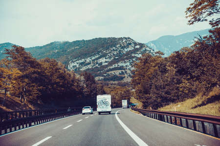 white van on highway. Camper on the road. camping carの写真素材
