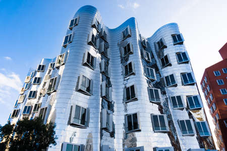 DUSSELDORF, GERMANY - NOVEMBER 08, 2014: View of the Neuer Zollhof in Media Harbor in Dusseldorf, Germany. This building complex was designed by Frank O. Gehry and completed in 1998.のeditorial素材