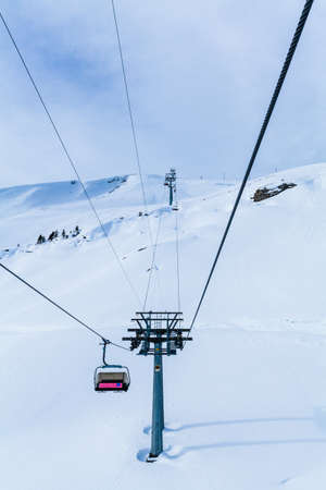 Mountains ski resort. Cable car. Winter in the swiss alps. mountain lift (funicular)の写真素材