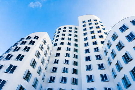 DUSSELDORF, GERMANY - NOVEMBER 08, 2014: View of the Neuer Zollhof in Media Harbor in Dusseldorf, Germany. This building complex was designed by Frank O. Gehry and completed in 1998.のeditorial素材