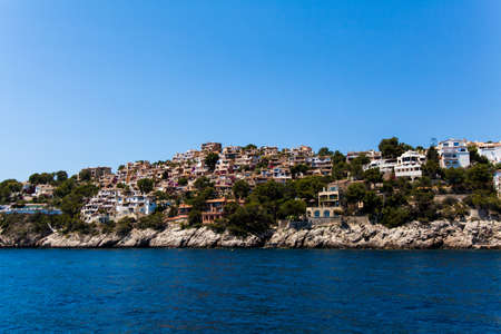 Apartment buildings by Mediterranean Sea. view of Mallorca coast, balearic islands, Spainの写真素材