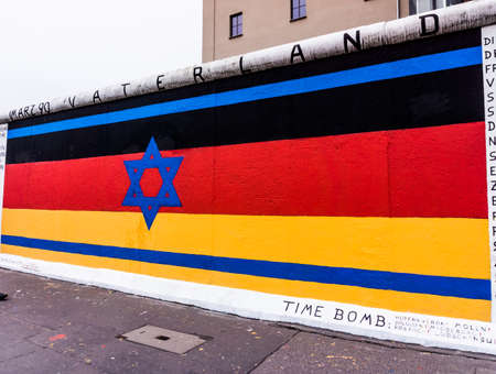 BERLIN, GERMANY - MARCH 20: Berlin Wall graffiti seen on March 22, 2015, Berlin, East Side Gallery. It's a 1.3 km long part of original Berlin Wall which collapsed in 1989.のeditorial素材