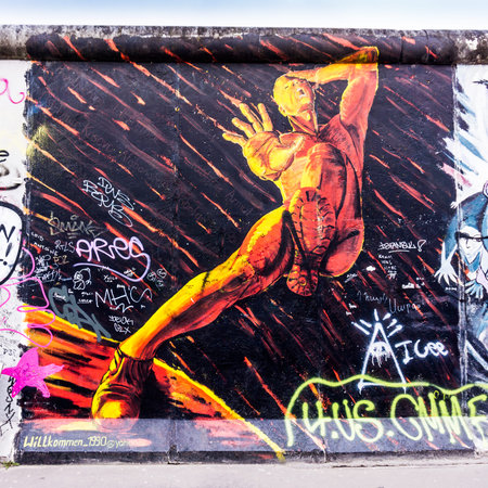 BERLIN, GERMANY - MARCH 20: Berlin Wall graffiti seen on March 22, 2015, Berlin, East Side Gallery. It's a 1.3 km long part of original Berlin Wall which collapsed in 1989.のeditorial素材