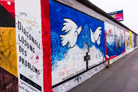 BERLIN, GERMANY - MARCH 20: Berlin Wall graffiti seen on March 22, 2015, Berlin, East Side Gallery. It's a 1.3 km long part of original Berlin Wall which collapsed in 1989.のeditorial素材