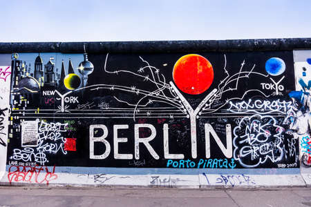 BERLIN, GERMANY - MARCH 20: Berlin Wall graffiti seen on March 22, 2015, Berlin, East Side Gallery. It's a 1.3 km long part of original Berlin Wall which collapsed in 1989.のeditorial素材