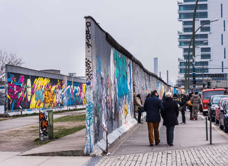 BERLIN, GERMANY - MARCH 20: Berlin Wall graffiti seen on March 22, 2015, Berlin, East Side Gallery. It's a 1.3 km long part of original Berlin Wall which collapsed in 1989.のeditorial素材