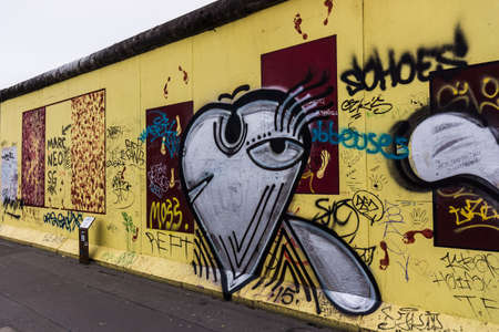 BERLIN, GERMANY - MARCH 20: Berlin Wall graffiti seen on March 22, 2015, Berlin, East Side Gallery. It's a 1.3 km long part of original Berlin Wall which collapsed in 1989.のeditorial素材