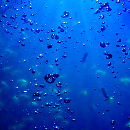 Water and air bubbles.  blue underwaterの写真素材