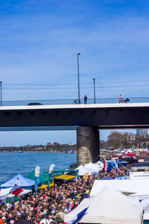 DUSSELDORF, GERMANY - APRIL 12, 2015: People are enjoying the traditional Dusseldorf  Fish Market. Fish Market By the harbor in Dusseldorf, Germanyのeditorial素材