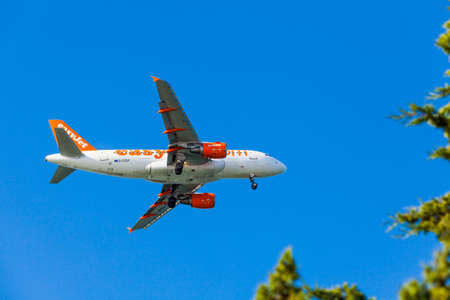 FARO,PORTUGAL-MAY 09:EasyJet Airline Airbus A319 arrives to the Faro International Airport, May 09, 2015 in Faro, Portugal. Easyjet had 145 A319's in serviceのeditorial素材