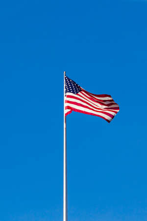 American flag on the blue skyの写真素材