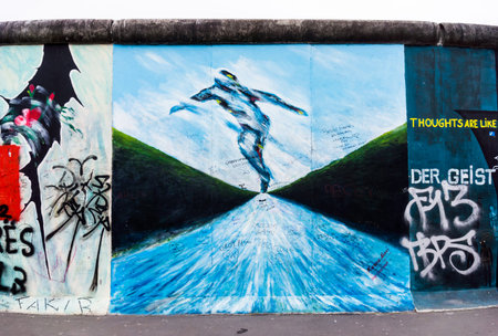 BERLIN, GERMANY - MARCH 20: Berlin Wall graffiti seen on March 22, 2015, Berlin, East Side Gallery. It's a 1.3 km long part of original Berlin Wall which collapsed in 1989のeditorial素材