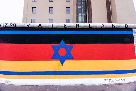 BERLIN, GERMANY - MARCH 20: Berlin Wall graffiti seen on March 22, 2015, Berlin, East Side Gallery. It's a 1.3 km long part of original Berlin Wall which collapsed in 1989のeditorial素材