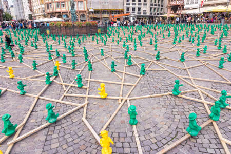 FRANKFURT, GERMANY - SEPTEMBER 19, 2015: figures from Ottmar Hoerl to celebrate the 25th anniversary of Germanys reunion in Frankfurt, Germany on public places.のeditorial素材
