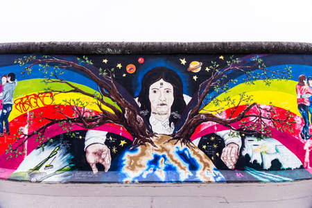 BERLIN, GERMANY - MARCH 20: Berlin Wall graffiti seen on March 22, 2015, Berlin, East Side Gallery. It's a 1.3 km long part of original Berlin Wall which collapsed in 1989のeditorial素材