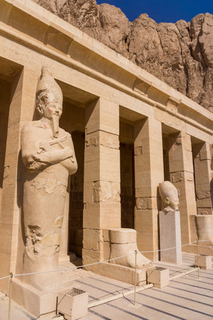 The temple of Hatshepsut near Luxor in Egypt.  Statues of Queen Hatshepsut as Osiris, the god of the...