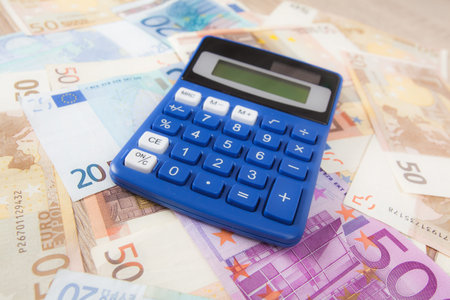 Calculator with Euro notes.  Budget Concept.  Money and calculatorの写真素材