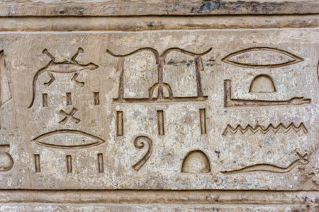 old egypt hieroglyphs. Hieroglyphic carvings on the exterior walls of an ancient egyptian temple