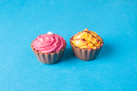Birthday cupcakes on blue background. many sweet  cupcakesの写真素材