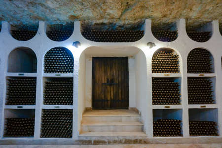 CRICOVA, MOLDOVA - JANUARY 03: underground wine cellar with collection of bottles in niches on January 03, 2015. The wine cellars of Cricova is second largest wine cellar in Moldovaのeditorial素材