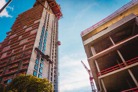 Crane and building construction. big building constructionの写真素材