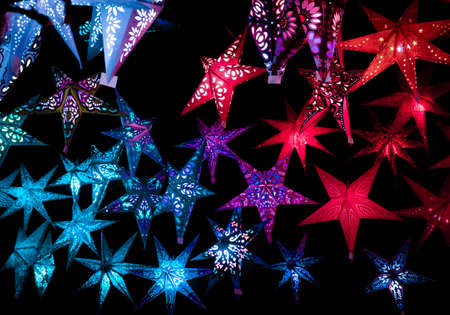 Beautiful christmas market stalls decorations. Colorful Christmas stars at a Christmas Marketの写真素材