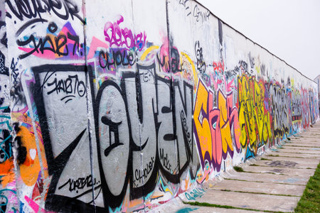 BERLIN, GERMANY - MARCH 20: Berlin Wall graffiti seen on March 22, 2015, Berlin, East Side Gallery. It's a 1.3 km long part of original Berlin Wall which collapsed in 1989のeditorial素材