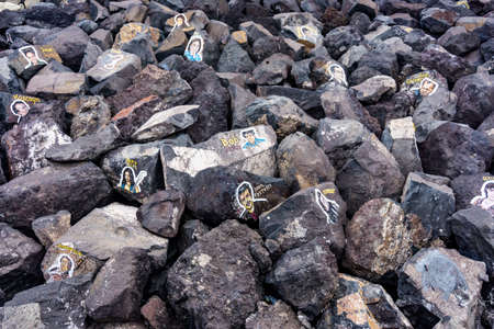 SANTA CRUZ DE TENERIFE, SPAIN - JANUARY 25: Graffiti on a stones of a breakwater on January 25, 2017 in Santa Cruz de Tenerife, Spainのeditorial素材