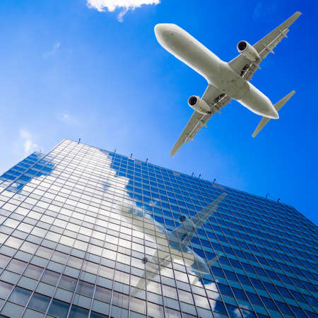 airplane with modern building. Jet over Cityのeditorial素材